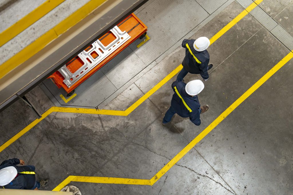international three factory workers walking overhead escobedo stampling 231205 3740